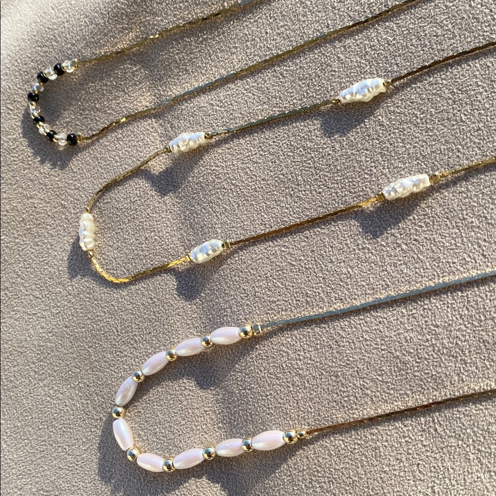 Three 1980s beaded necklaces.